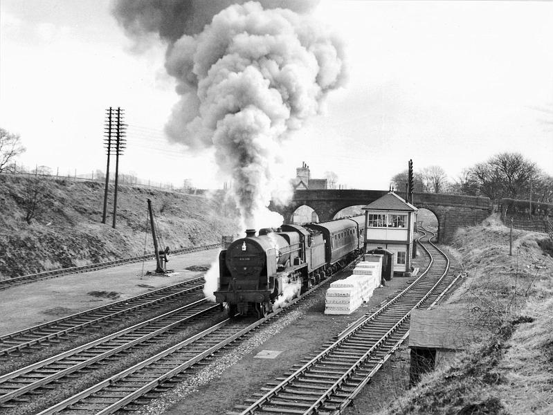 Loco 45510.jpg - Number  45510   - LMS Patriot  Class 4-6-0  - Designed by Henry Fowler.  Built Aug 1932 at  Crewe Works  for the LMS Railway.  Photographed on 24th March 1962 with the Leeds to Morecambe passenger. Stacked in front of the signal box are concrete conduits used for putting the electricity cables underground.  ( Photo 1950's)  A total of 52 Patriots were built between 1930 and 1934 at Crewe and Derby; they were designed for express passenger service. It was shedded at Willesden in 1948. Its last shed was Lancaster Green, Ayre.  Withdrawn from service in June 1962 & disposed of in Aug 1962.